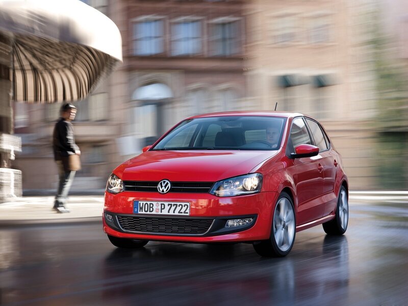 Red Volkswagen Polo in city