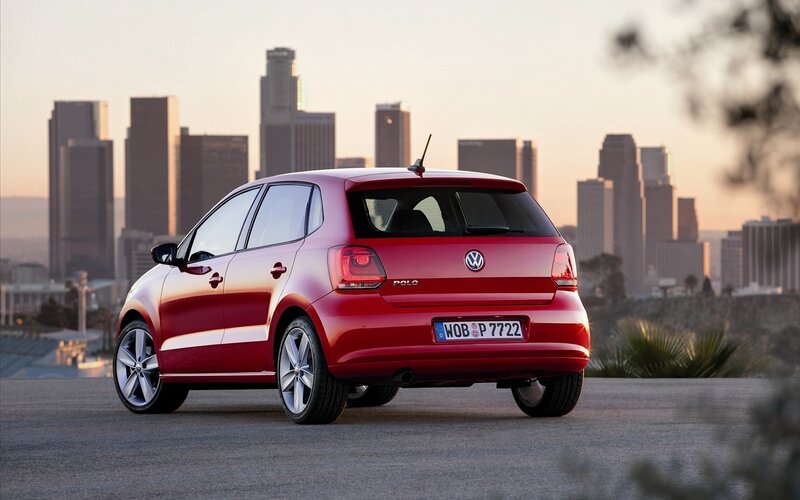 Red Volkswagen Polo in city