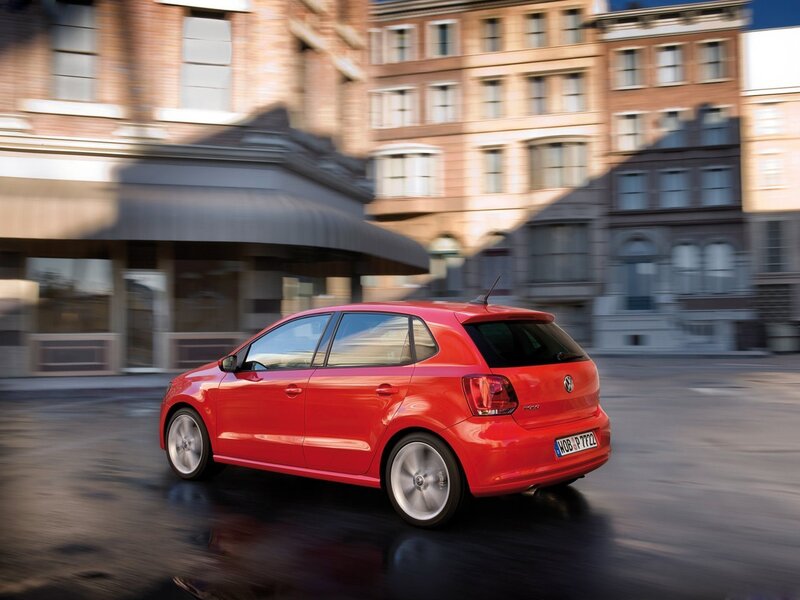 Red Volkswagen Polo in city