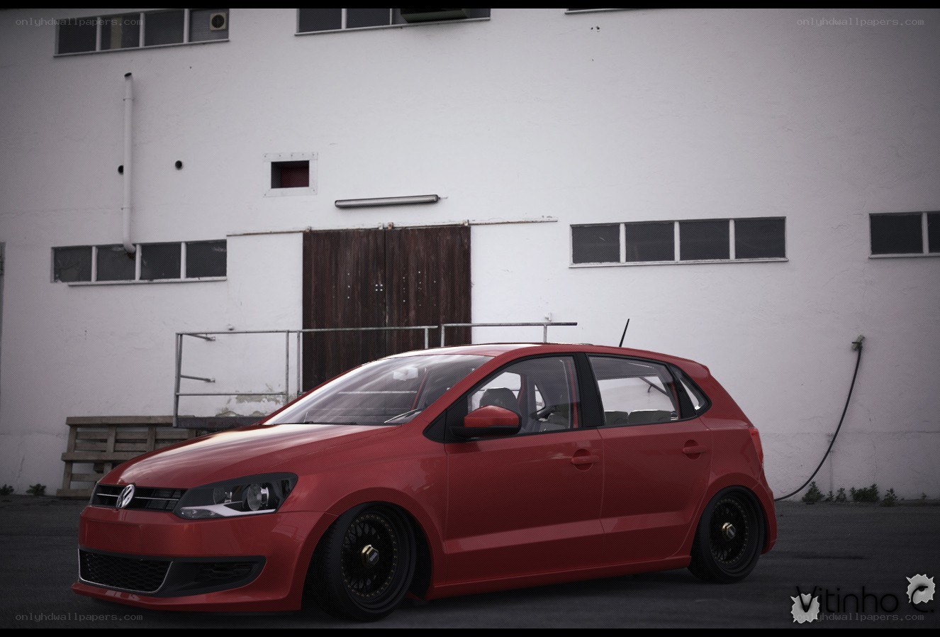 Red Volkswagen Polo parked outside