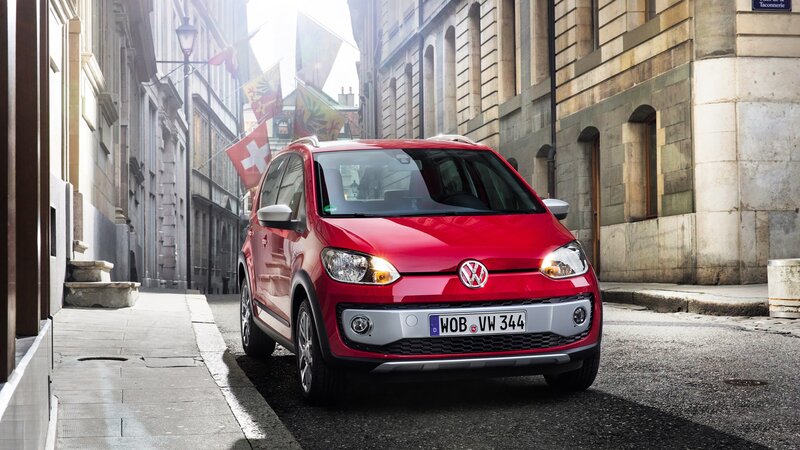 Red Volkswagen up! parked in city
