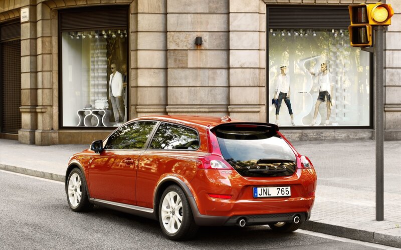 Red Volvo C30 parked on street