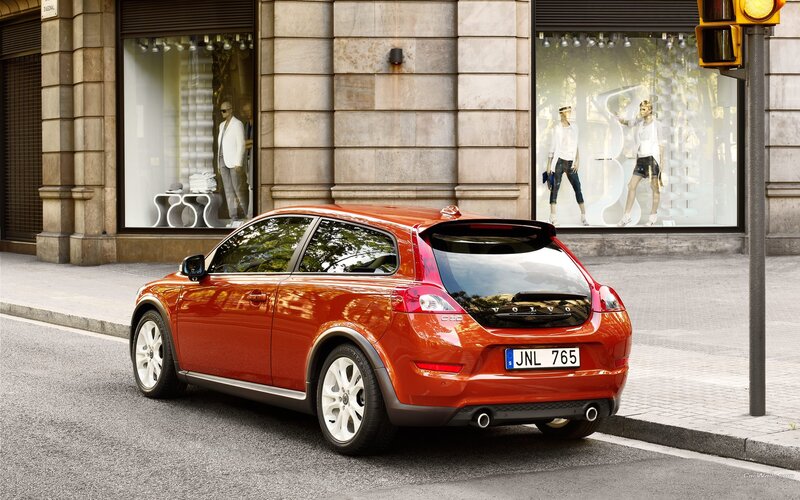 Red Volvo C30 parked on street