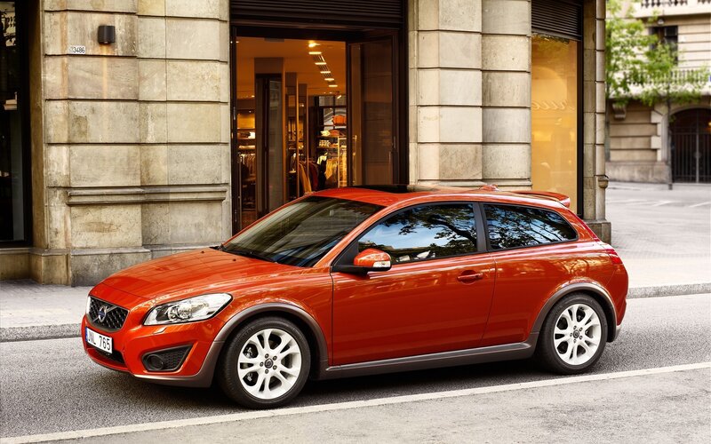 Red Volvo C30 parked on street