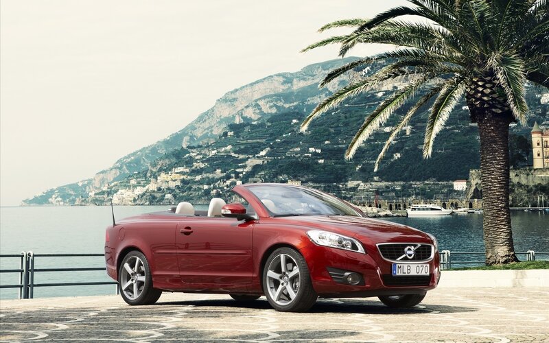 Red Volvo C70 convertible by the sea