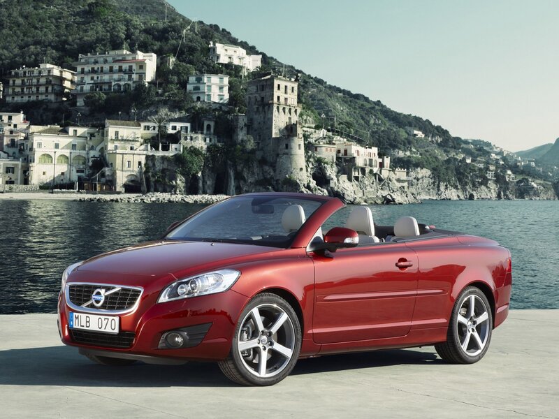 Red Volvo C70 convertible by the sea