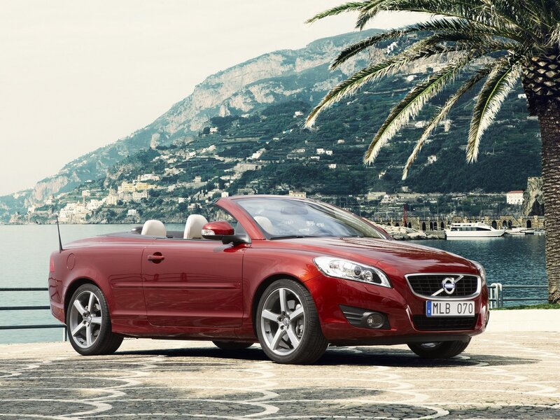 Red Volvo C70 convertible by the sea