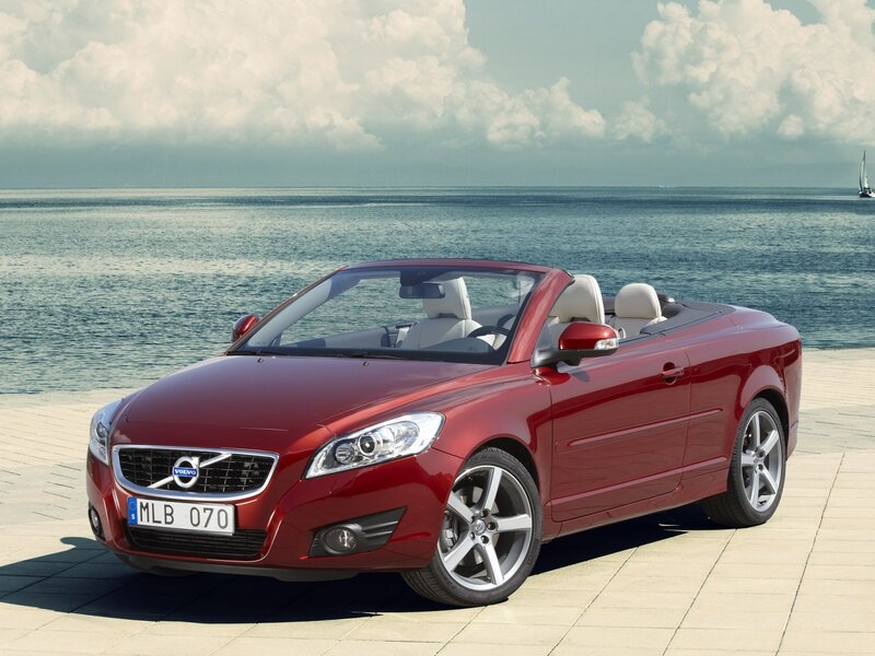 Red Volvo C70 convertible by the sea