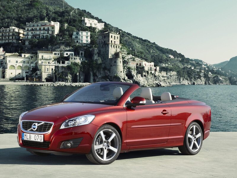 Red Volvo C70 convertible by the sea