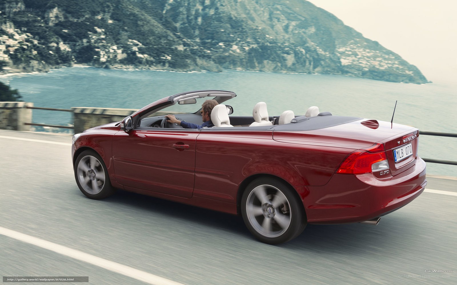 Red Volvo C70 convertible driving