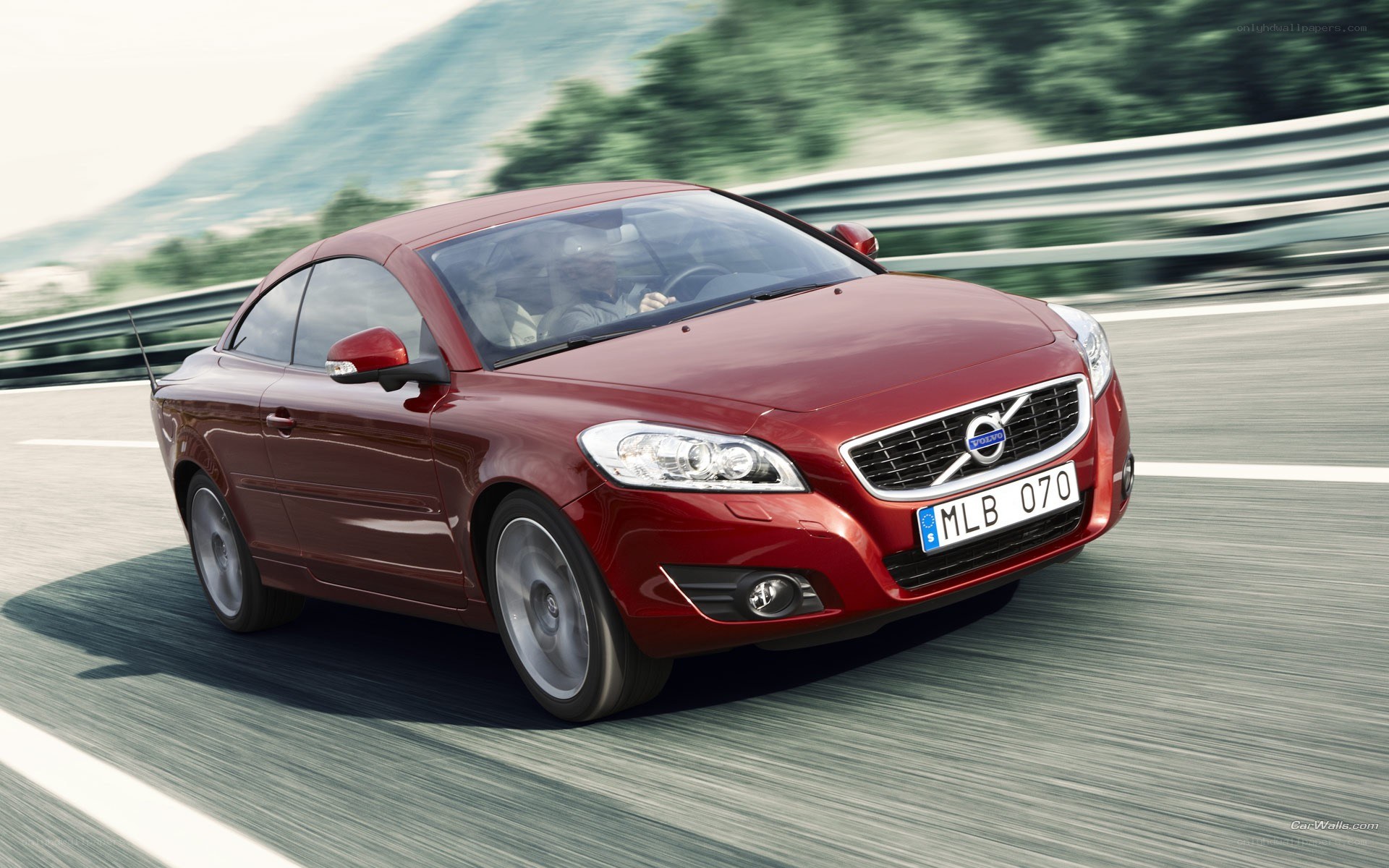Red Volvo C70 in motion