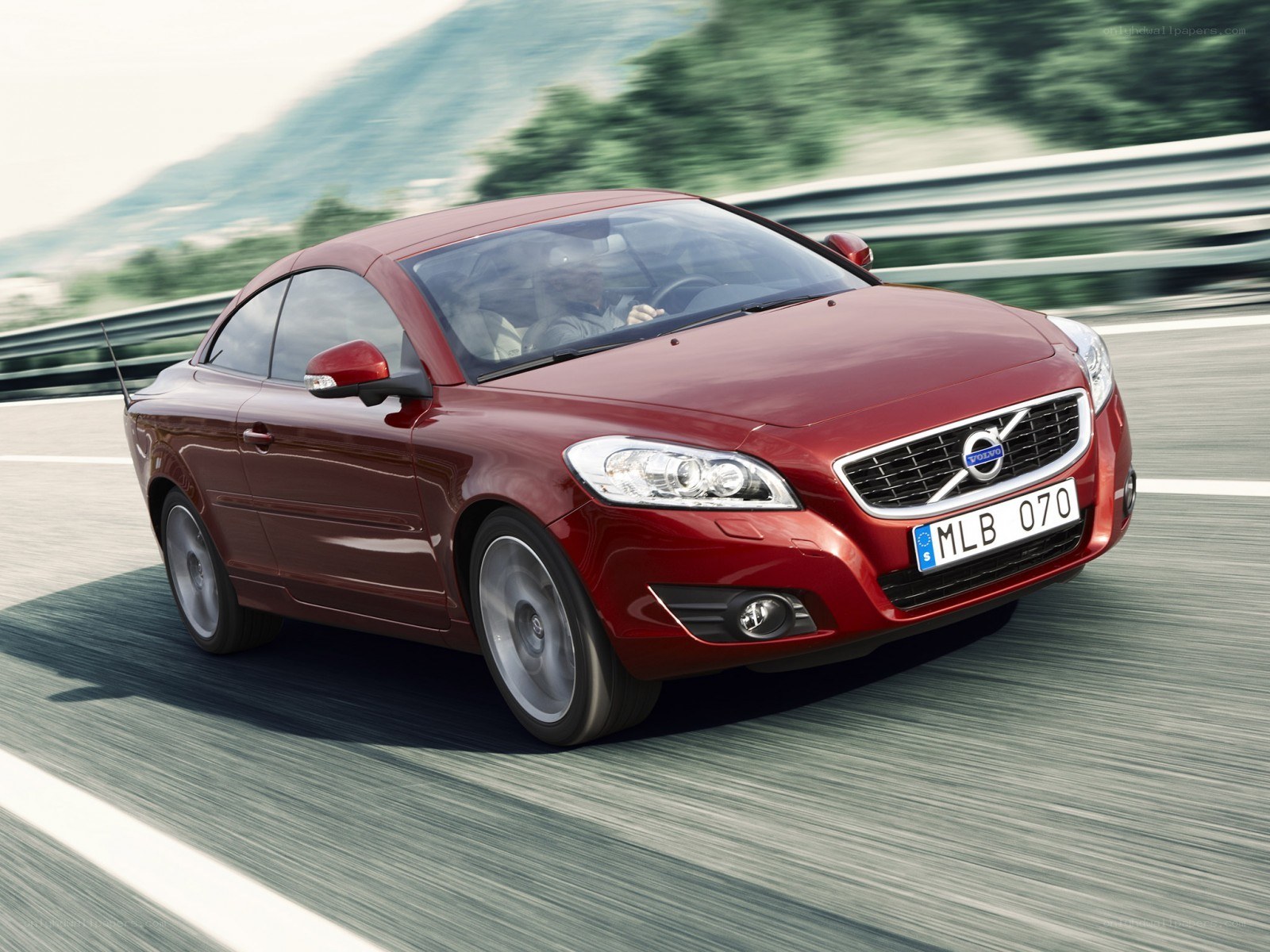 Red Volvo C70 in motion