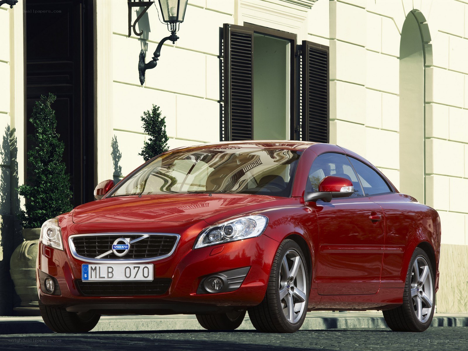 Red Volvo C70 parked outside