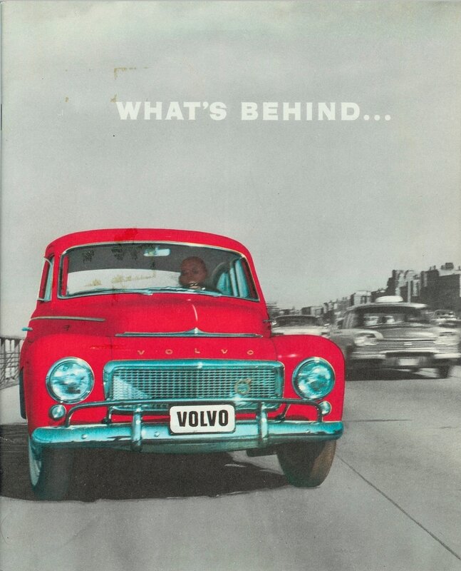 Red Volvo car on a road