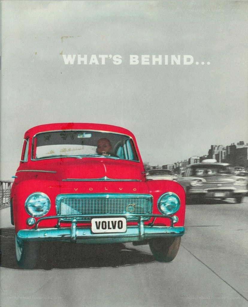Red Volvo car on a road