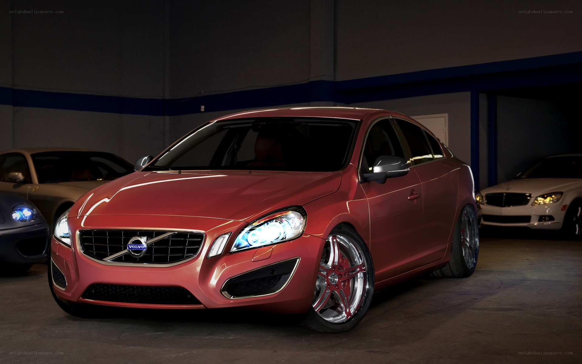 Red Volvo in a garage