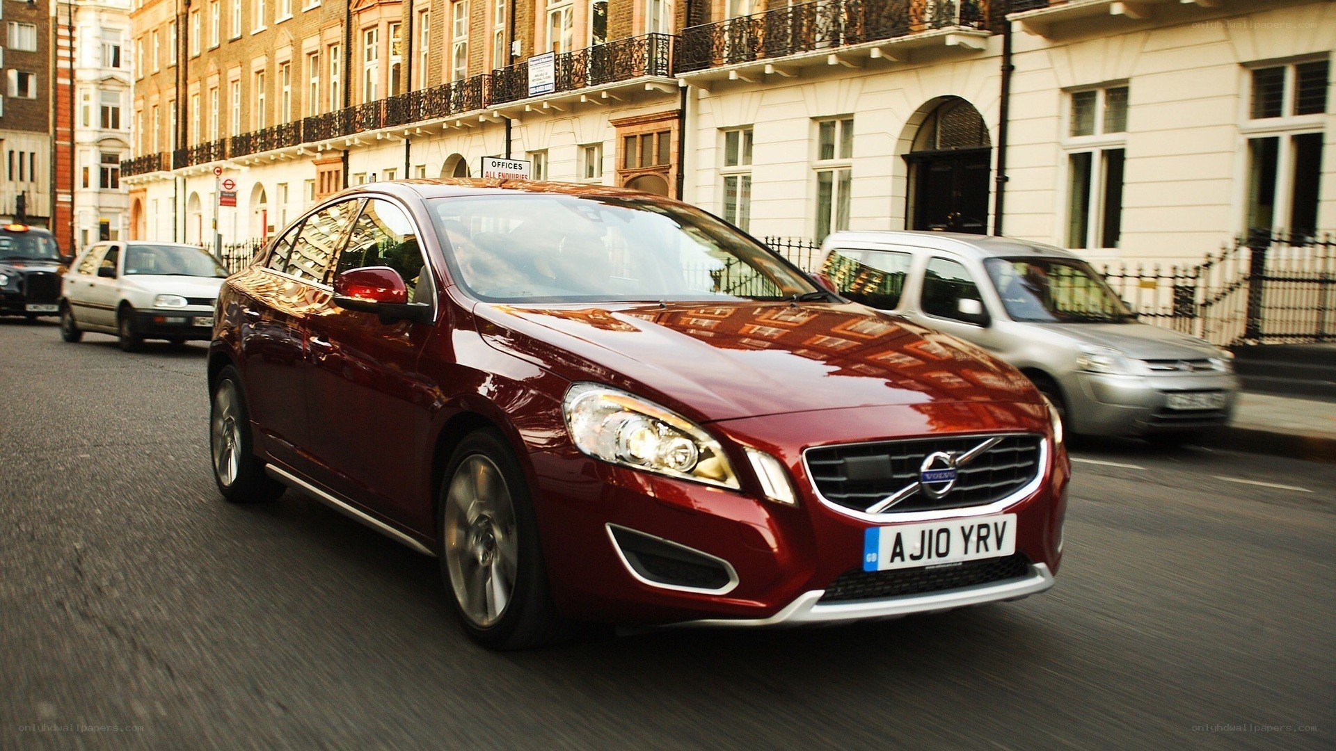 Red Volvo on city street
