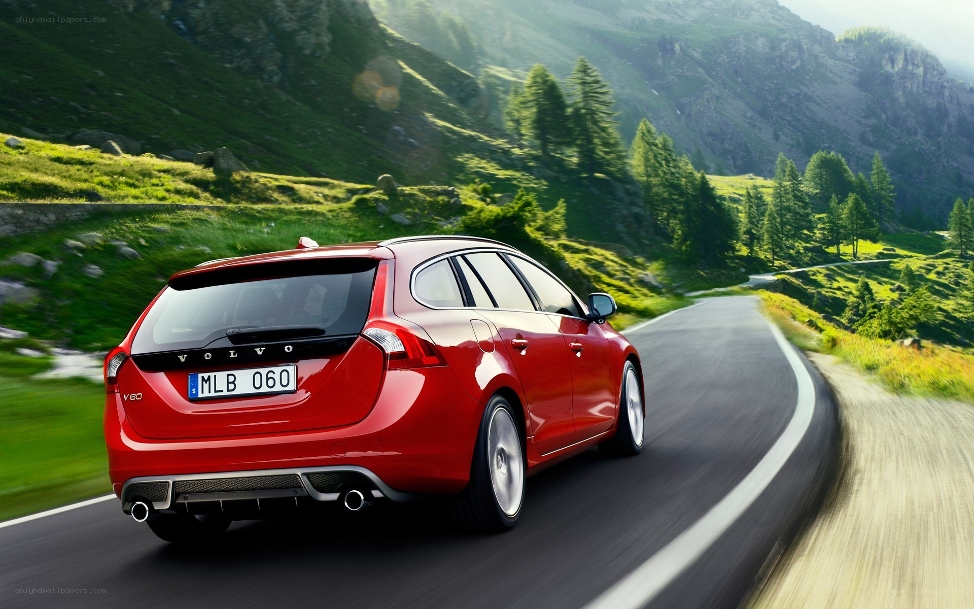 Red Volvo on mountain road