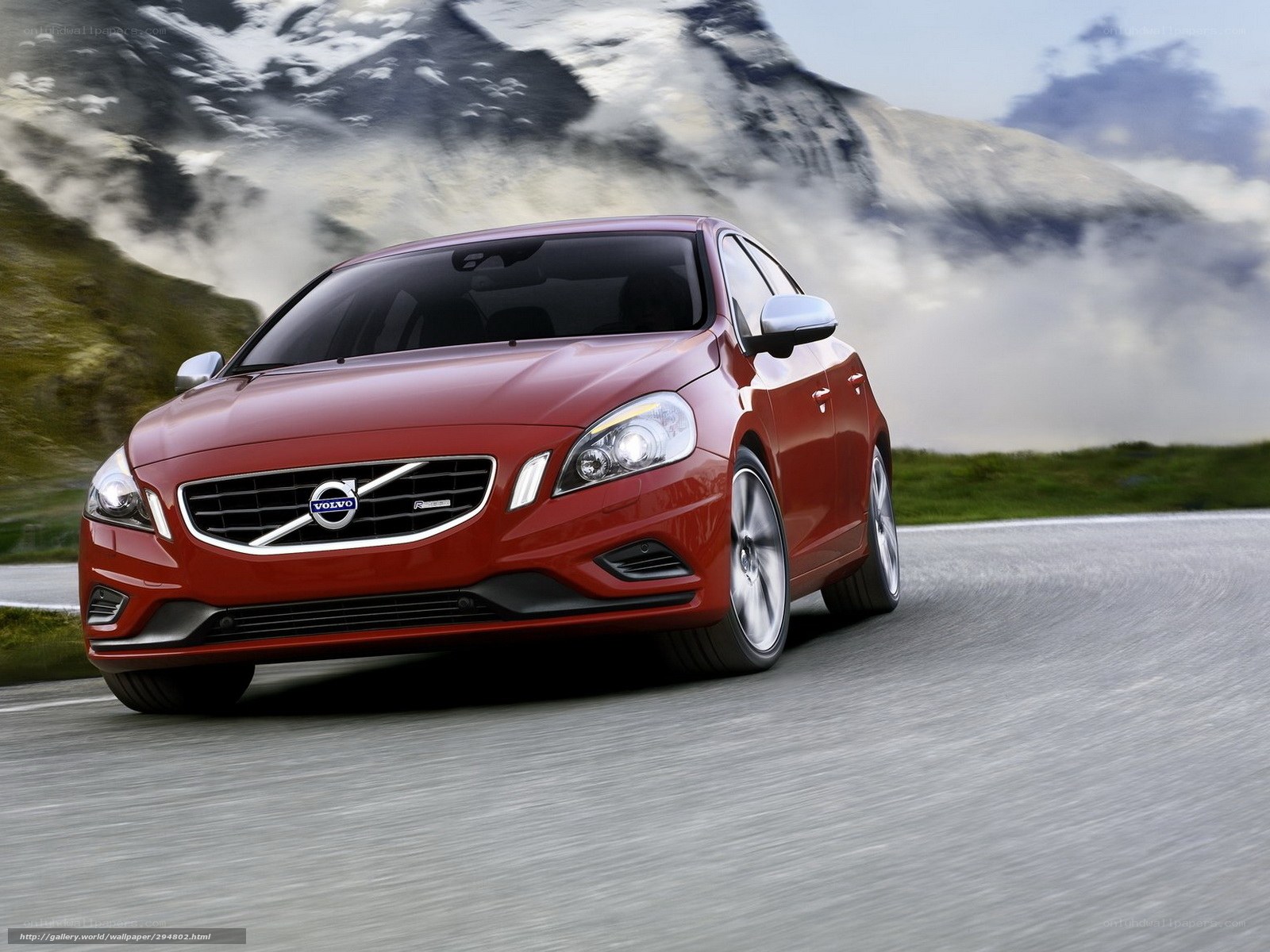 Red Volvo on mountain road
