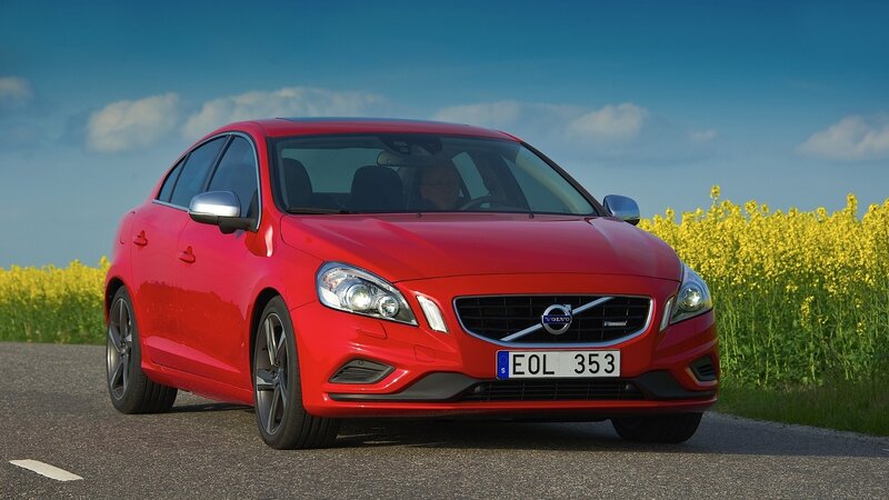 Red Volvo S60 in a field
