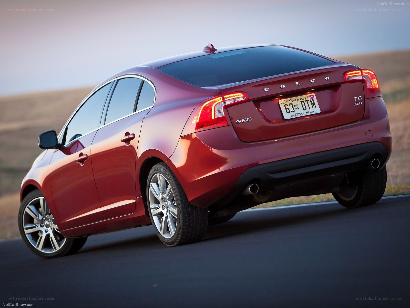 Red Volvo S60 in motion