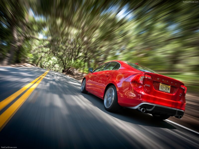 Red Volvo S60 in motion