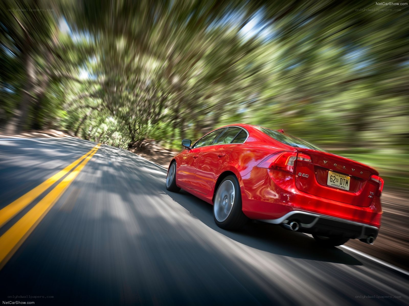 Red Volvo S60 in motion