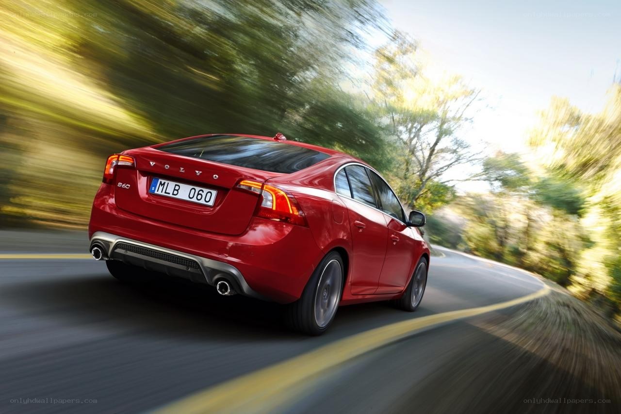 Red Volvo S60 in motion