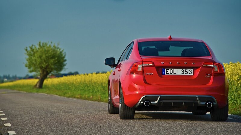 Red Volvo S60 on a country road