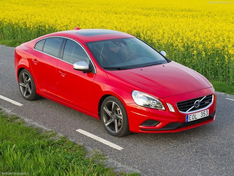 Red Volvo S60 on a country road