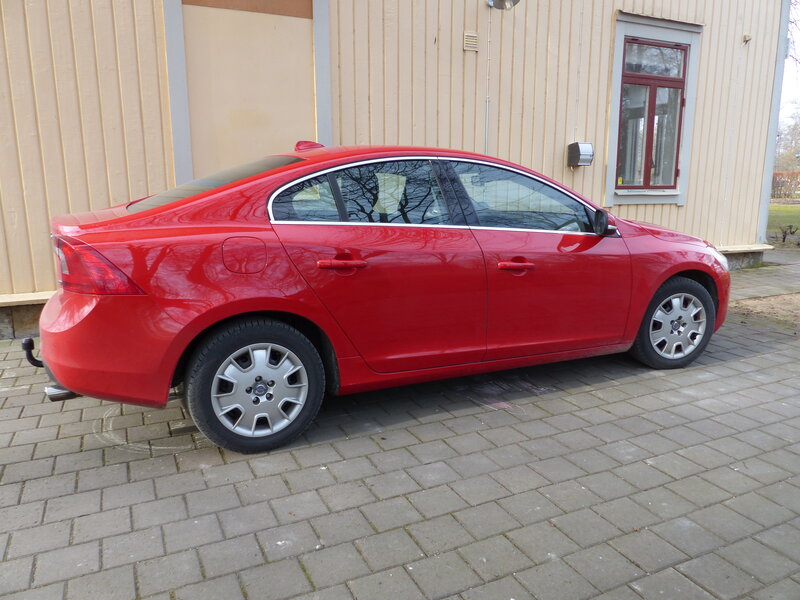 Red Volvo Sedan — Neutral