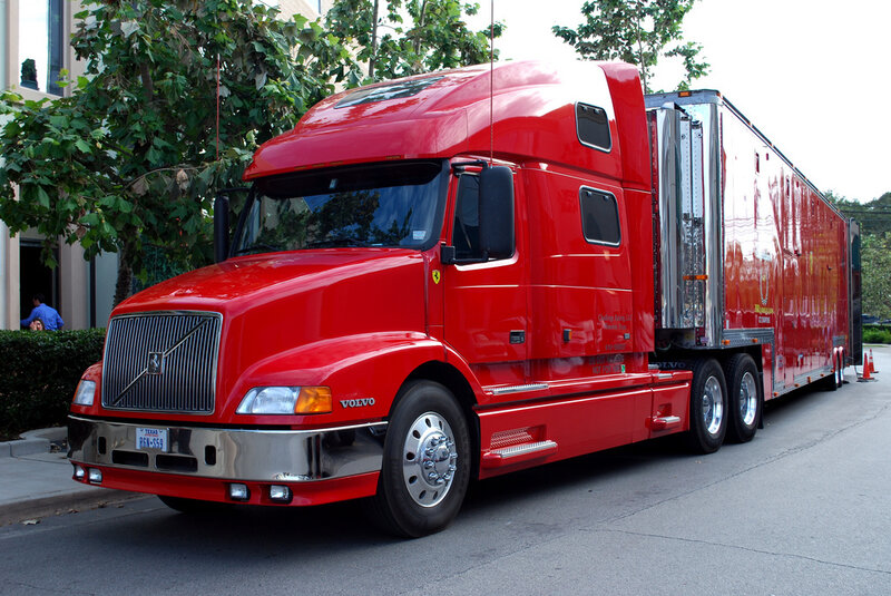 Red Volvo semi-truck with trailer