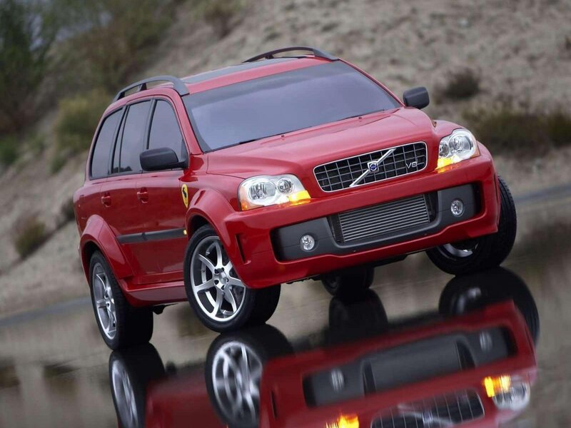 Red Volvo XC90 on wet road