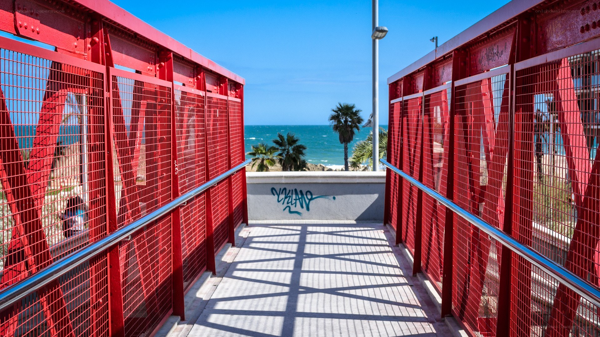 Red walkway to the beach