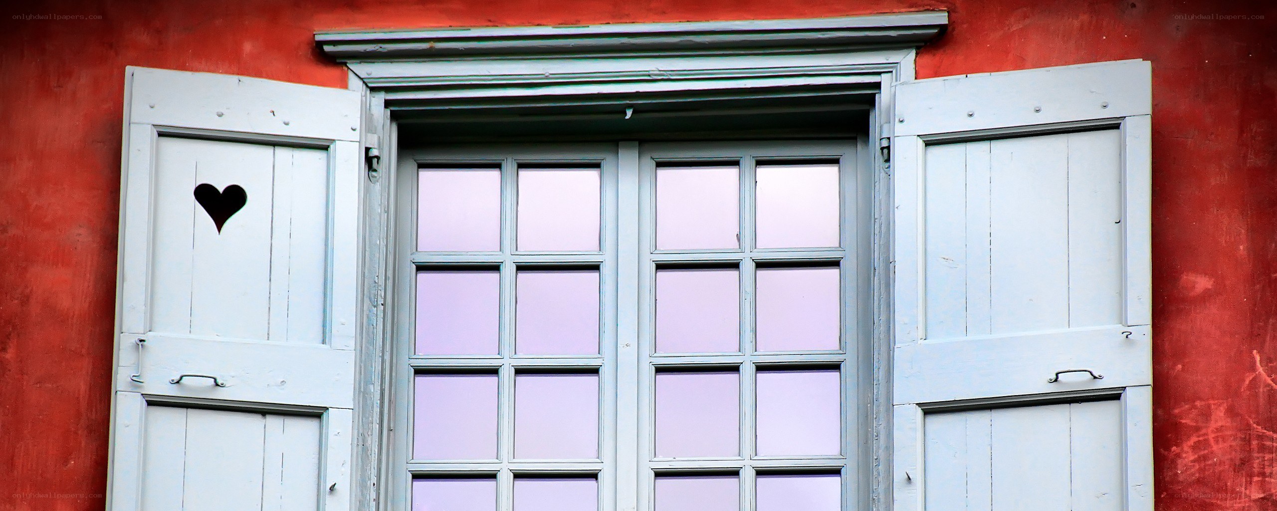 Red wall with heart-shaped window