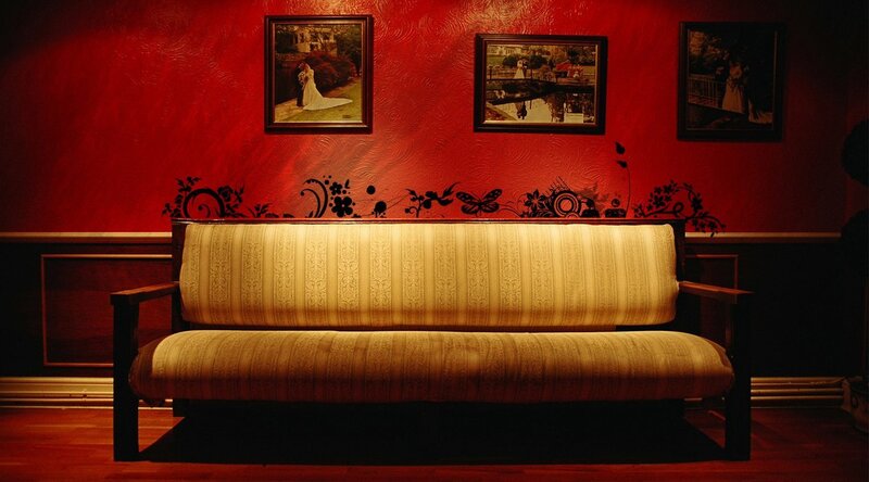Red-walled room with sofa