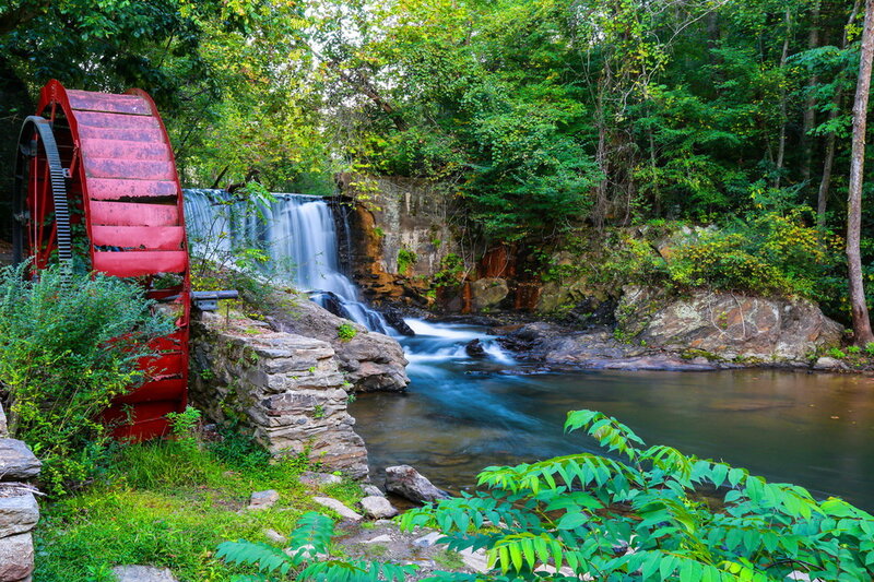 Red Water Wheel and Waterfall