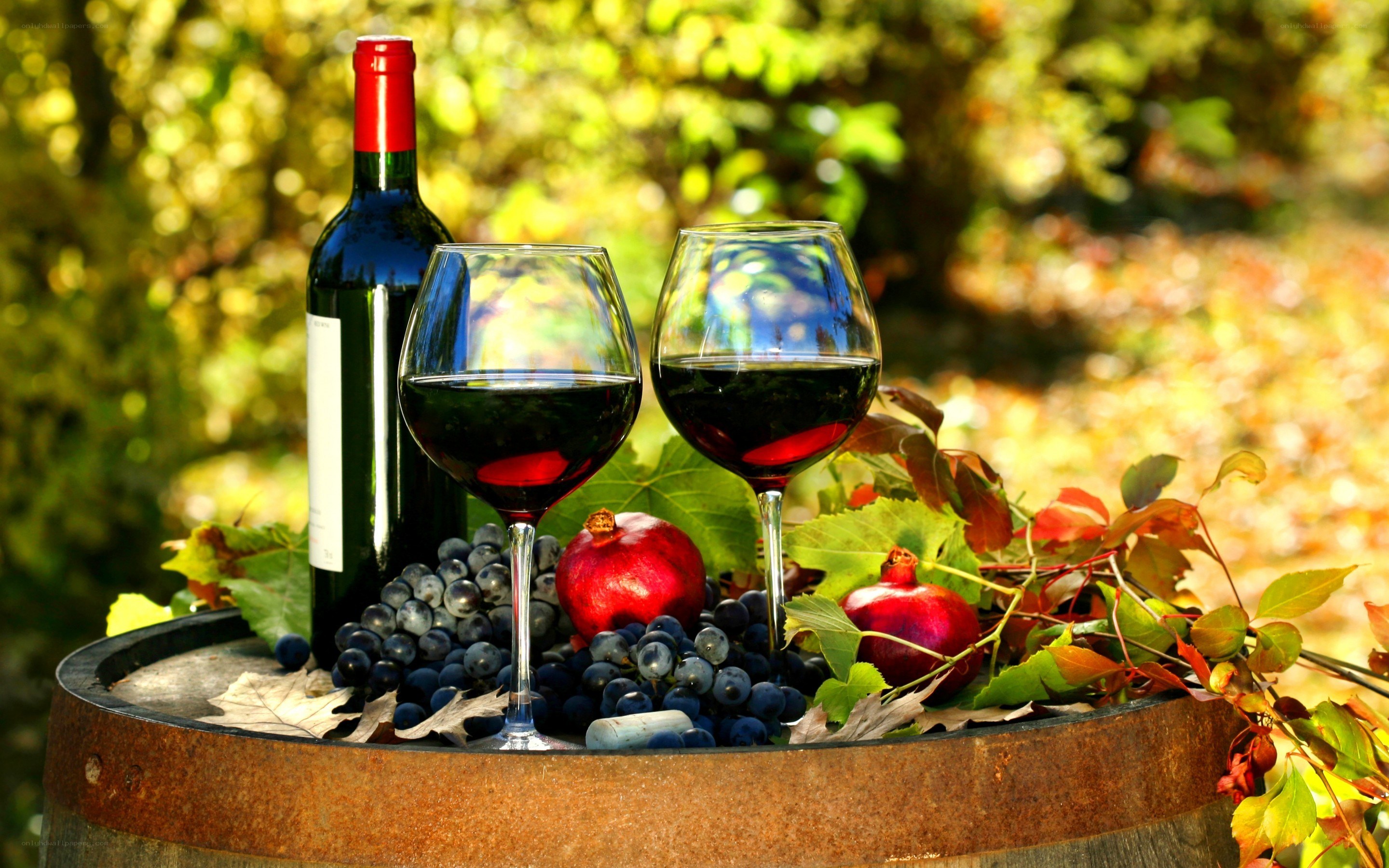 Red wine and fruit on barrel