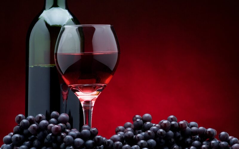Red wine and grapes