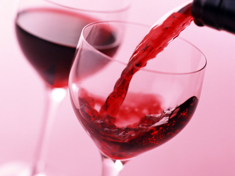 Red Wine Being Poured — Bottle