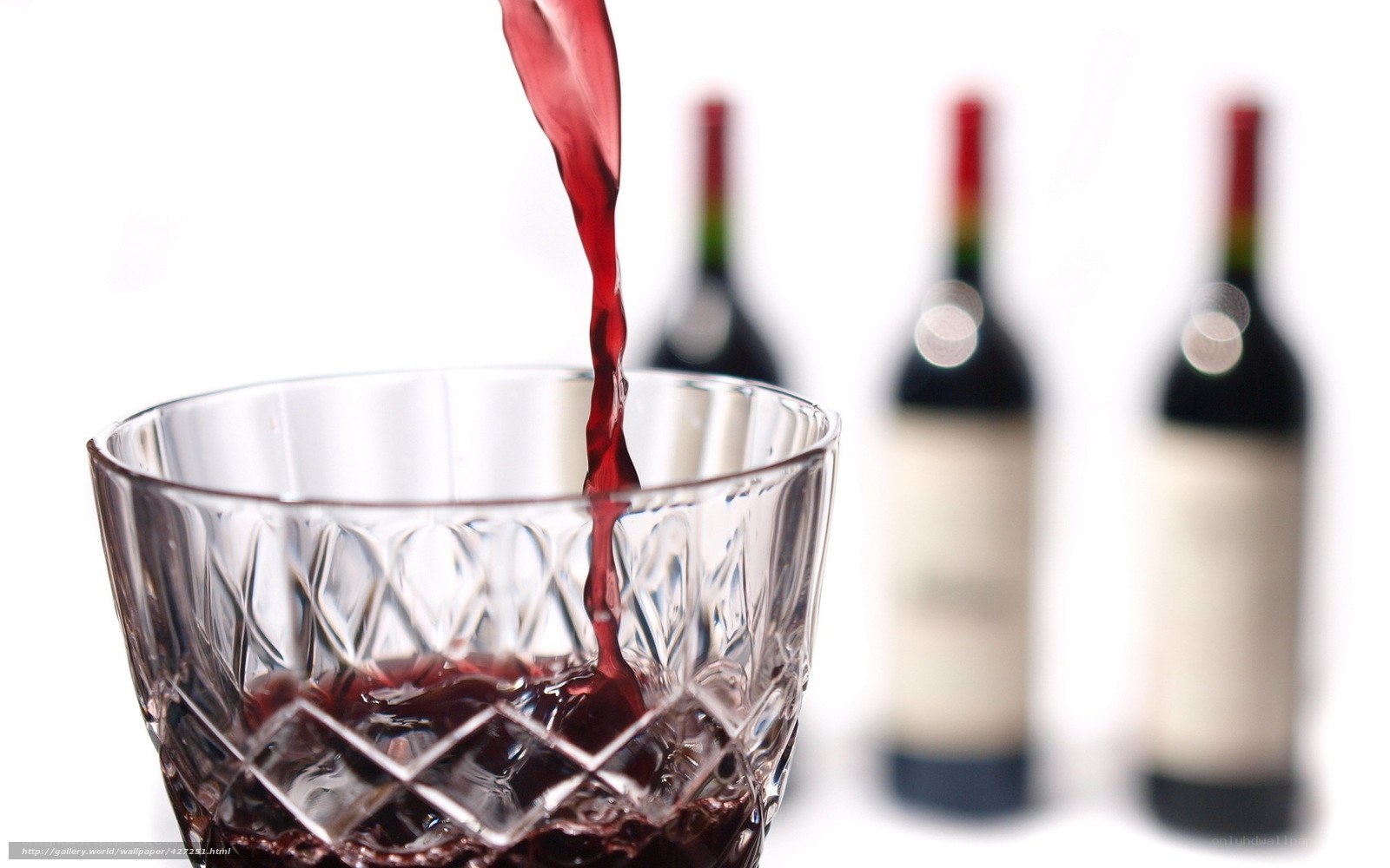red wine being poured into glass