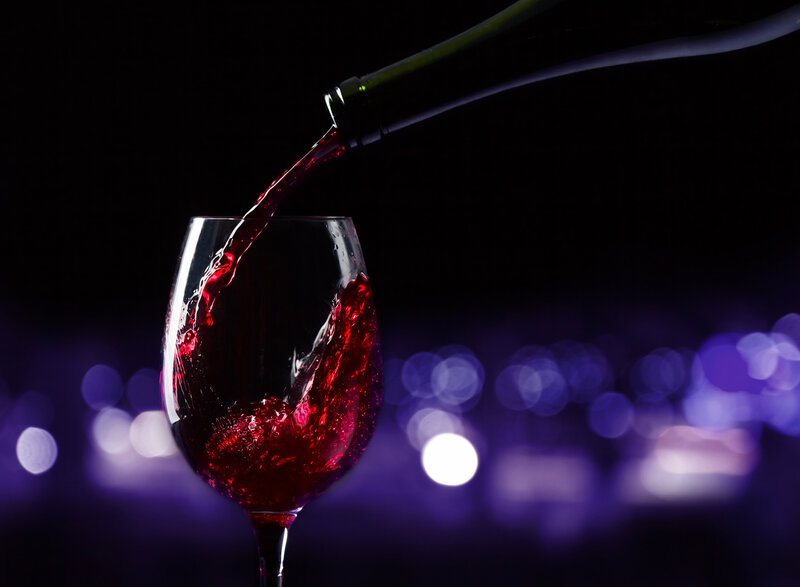 Red Wine Being Poured — Purple