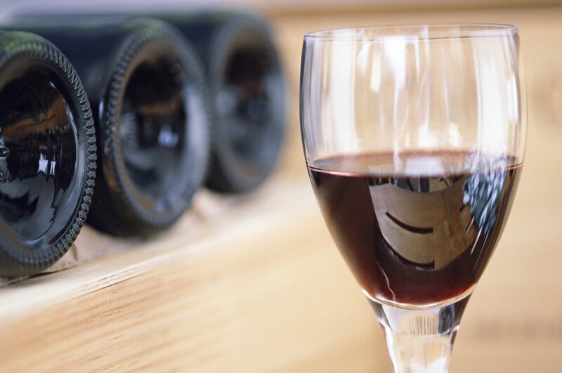 Red wine glass and bottles