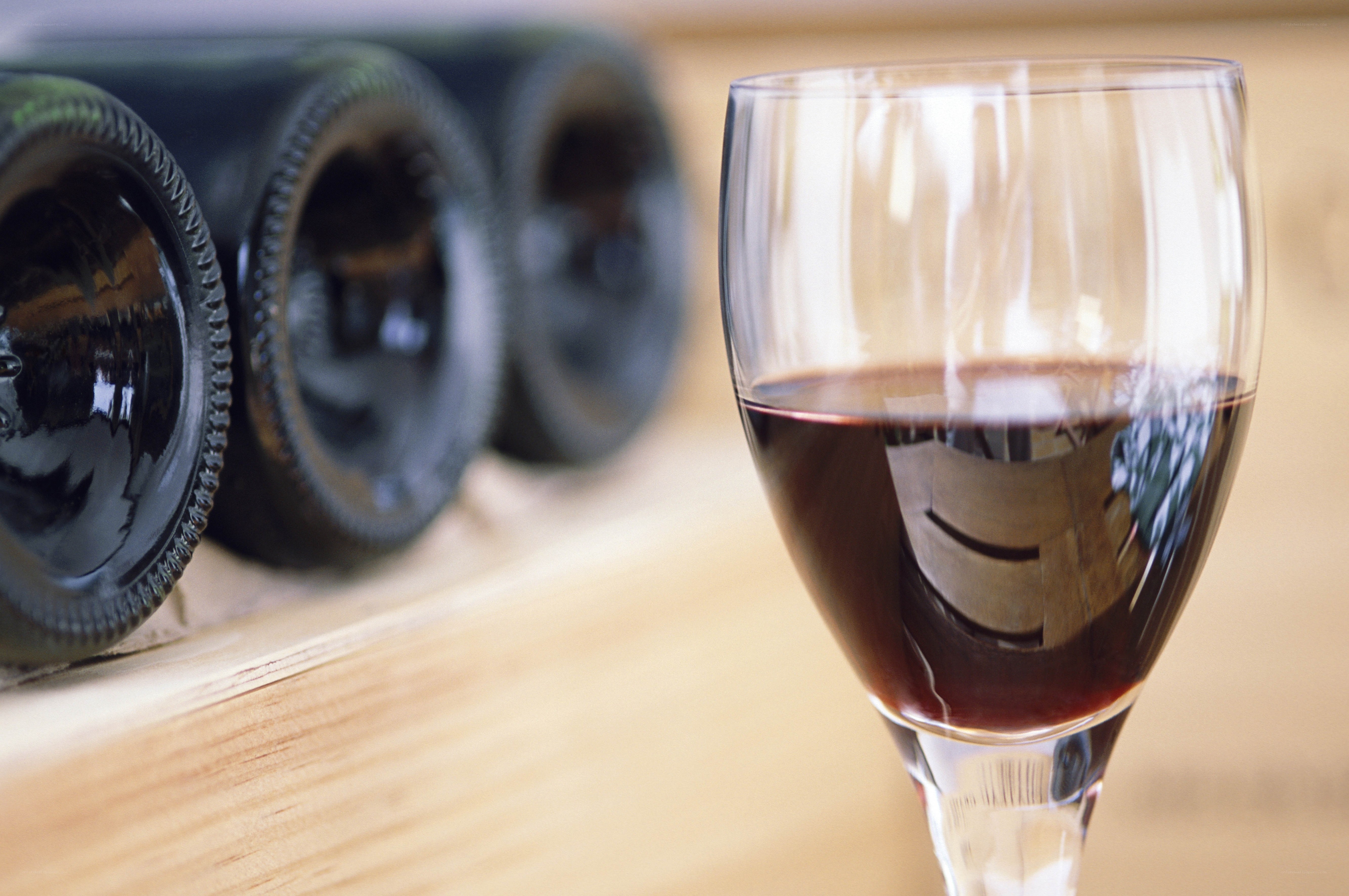 Red wine glass and bottles
