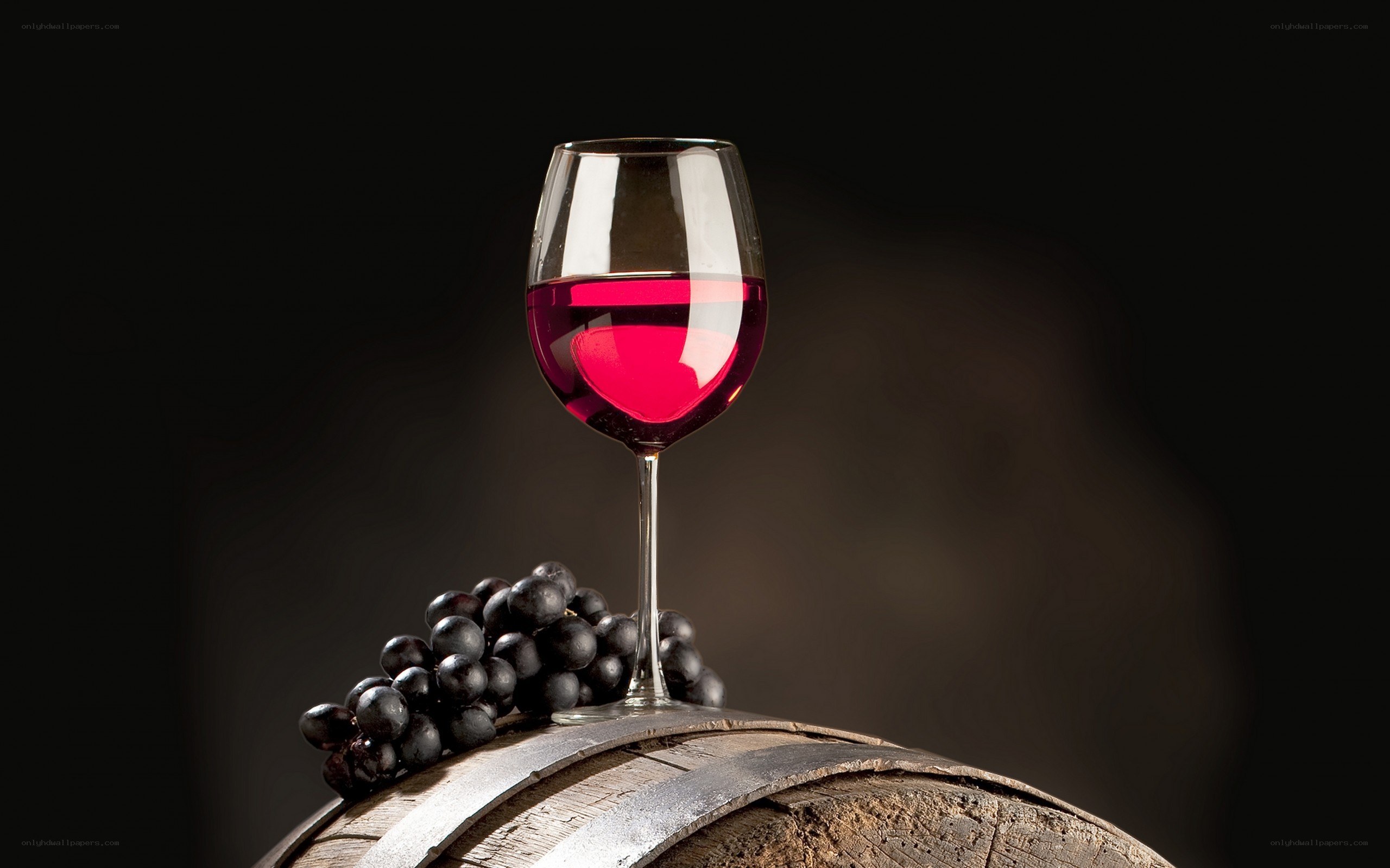 Red wine glass on barrel