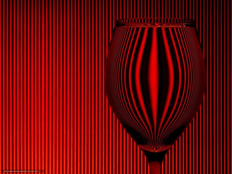 Red wine glass on striped background