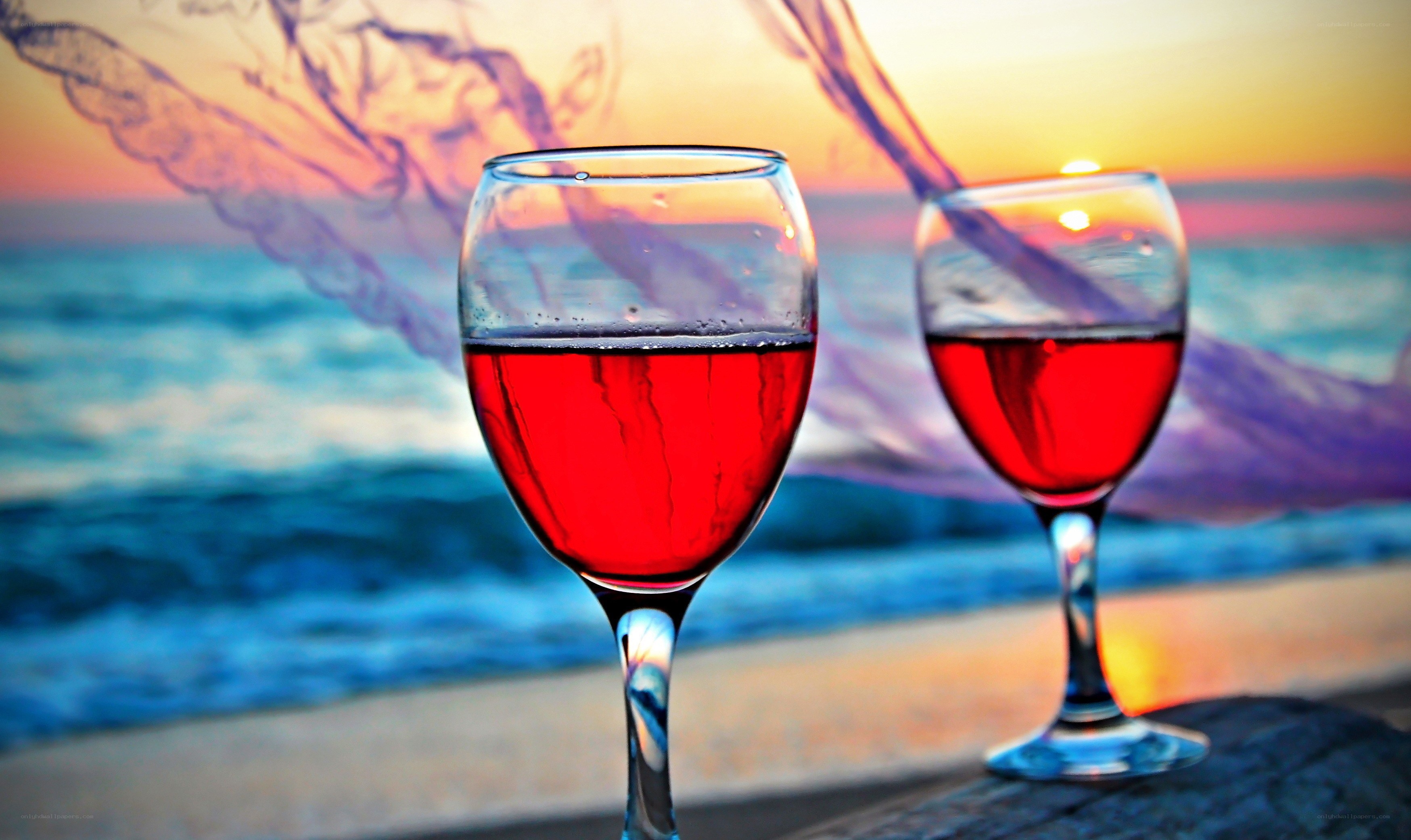 Red wine glasses at sunset