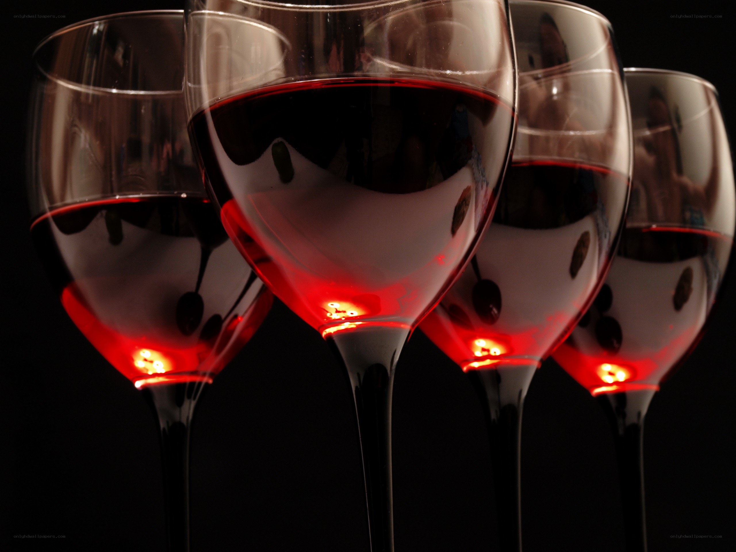 Red wine glasses in dim light