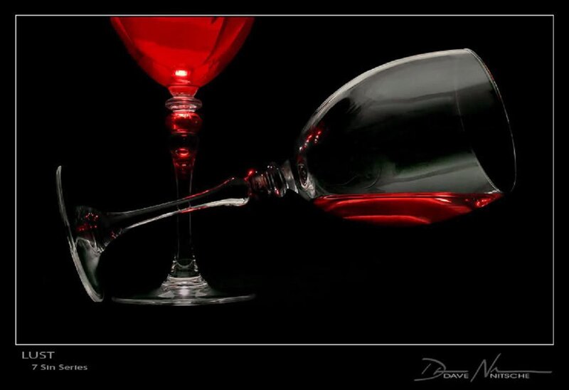 Red wine glasses on black