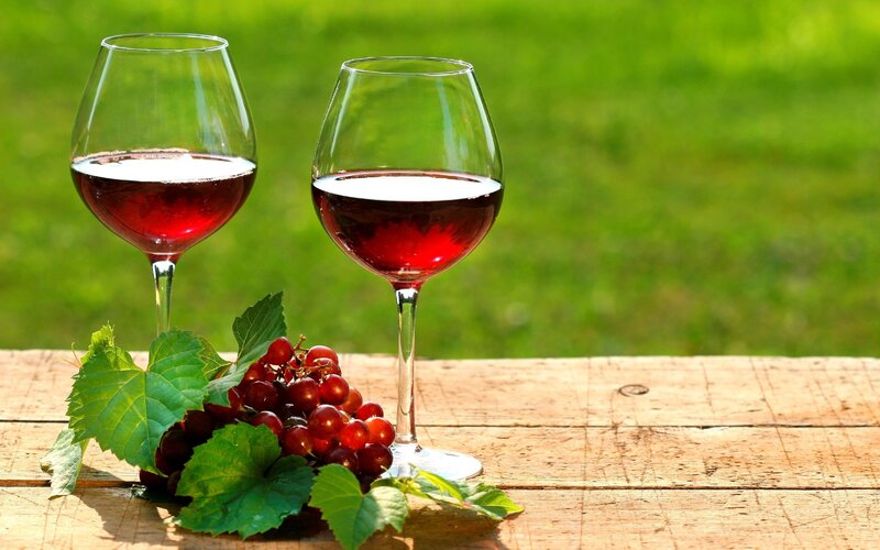 Red wine glasses with grapes